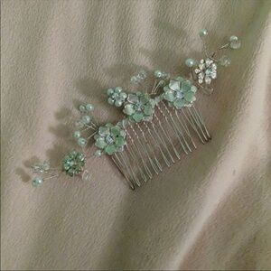 Silver beaded hair piece.